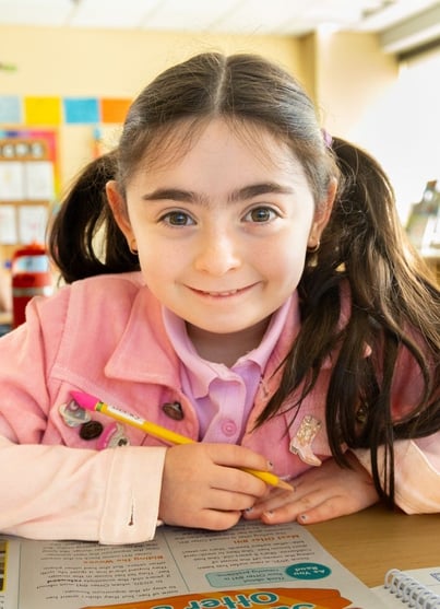 elementary school girl at desk