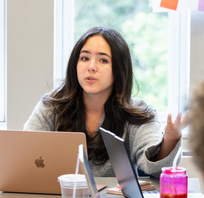 female student in round table discussion