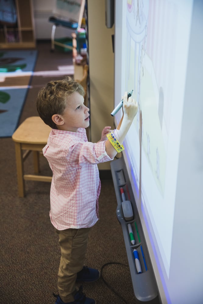 lower-school-student-smartboard