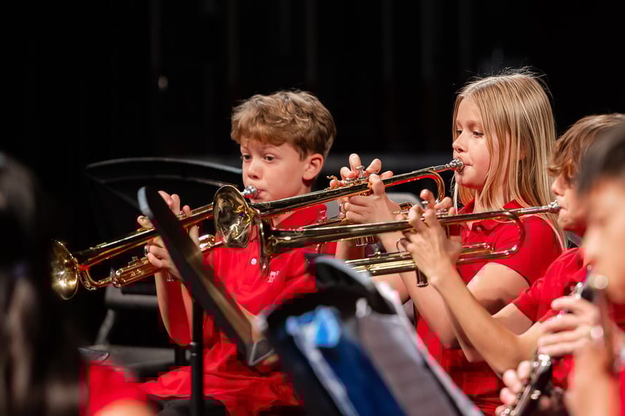 Middle School boys and girls playing the trumpet
