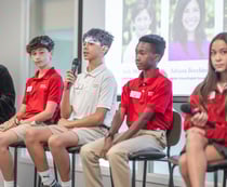 middle school students engaged in public speaking