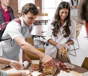 Friends Academy students making sandwiches
