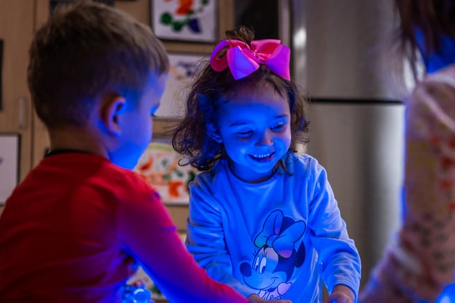 early childhood student at light table
