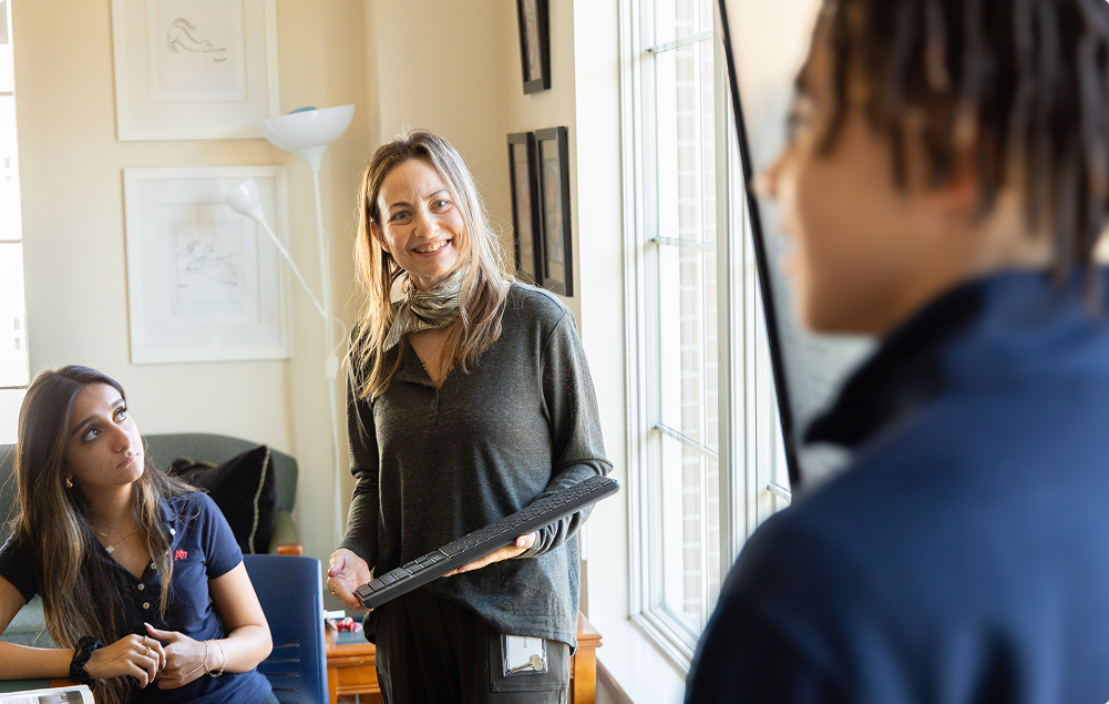 Teacher holding a computer keyboard