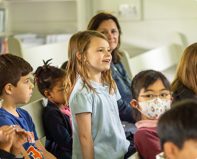 Young female student in light blue shirt