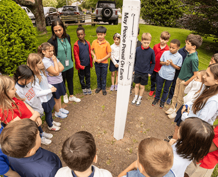 FA students standing in a cirlce during Peace Week