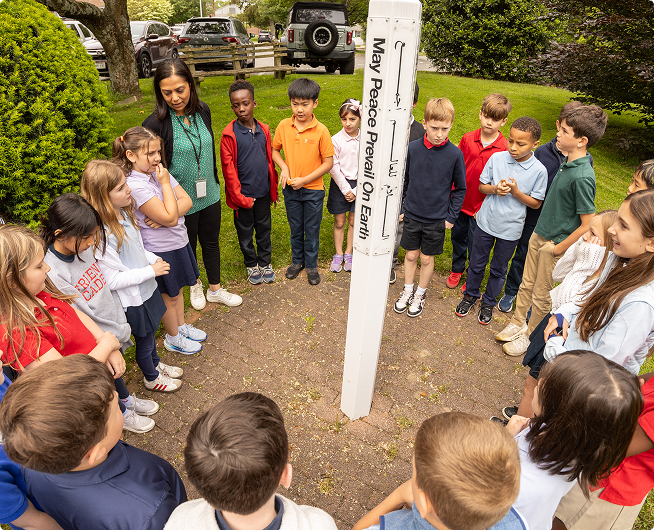 FA students standing in a cirlce during Peace Week