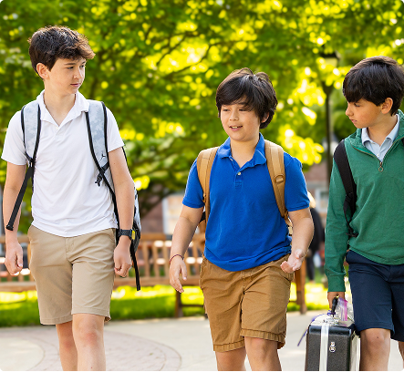 Middle school boys walking with backpacks
