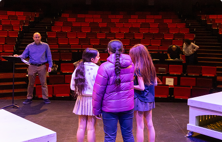 Friends Academy girls rehearsing lines