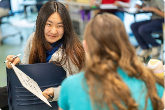 Two Friends Academy Students Talking Outside