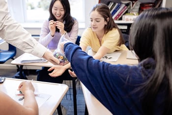 Students pick out dice for an AP Statistics challenge