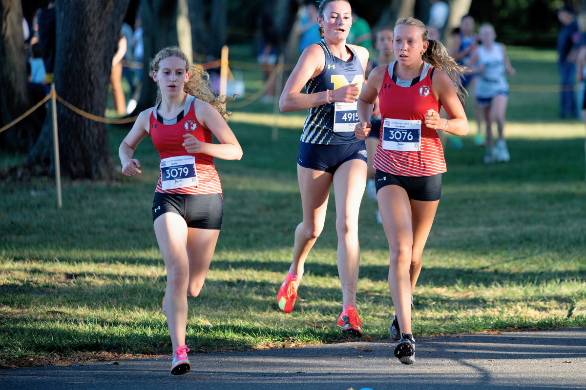 Ariana Madeira '29 and Charlotte Yanke '26 compete at States Cross Country meet