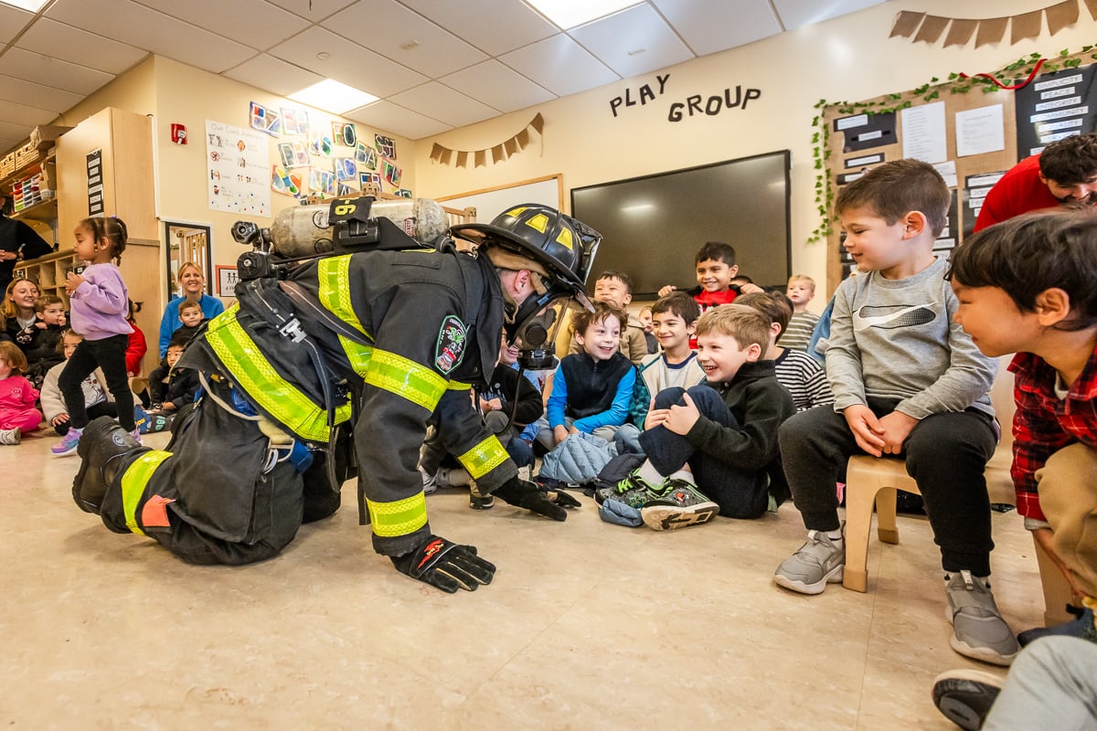 Glen Cove fireman visits 3's Play Group at Friends Academy.