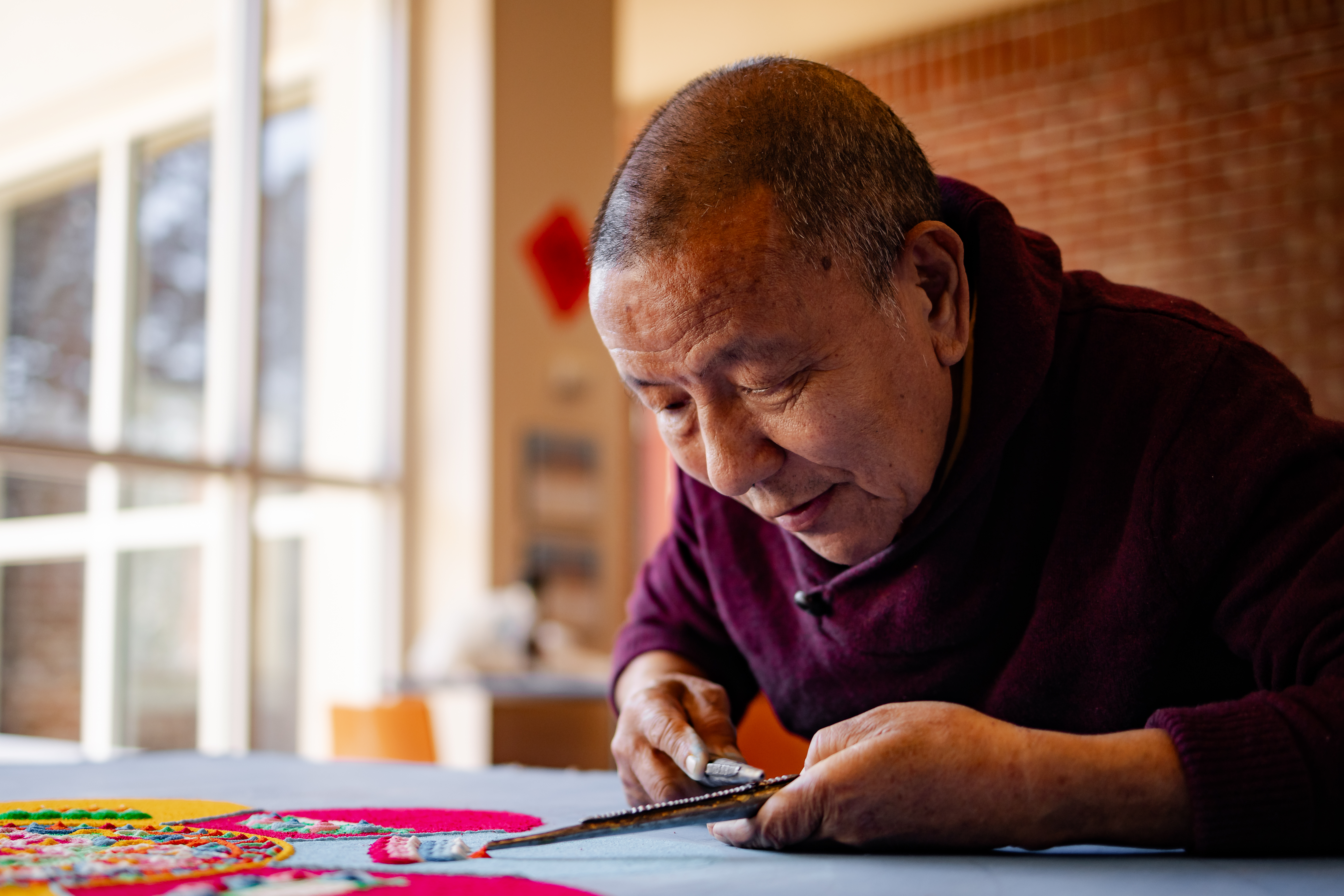 Lama Tenzin creates a mandala