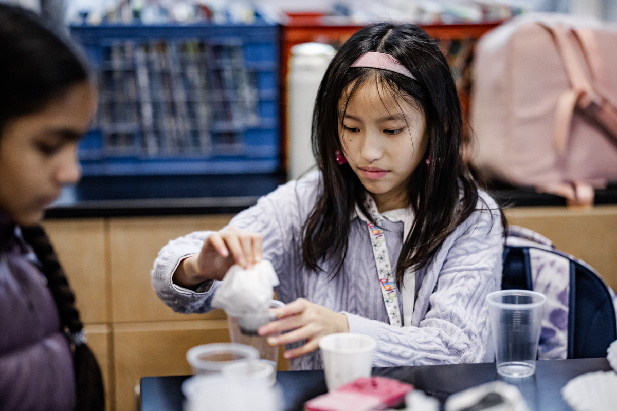 Middle school girl filters dirty water