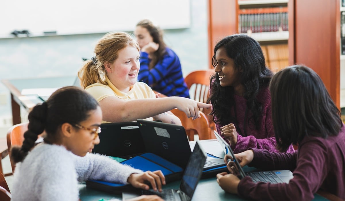 middle school students in library