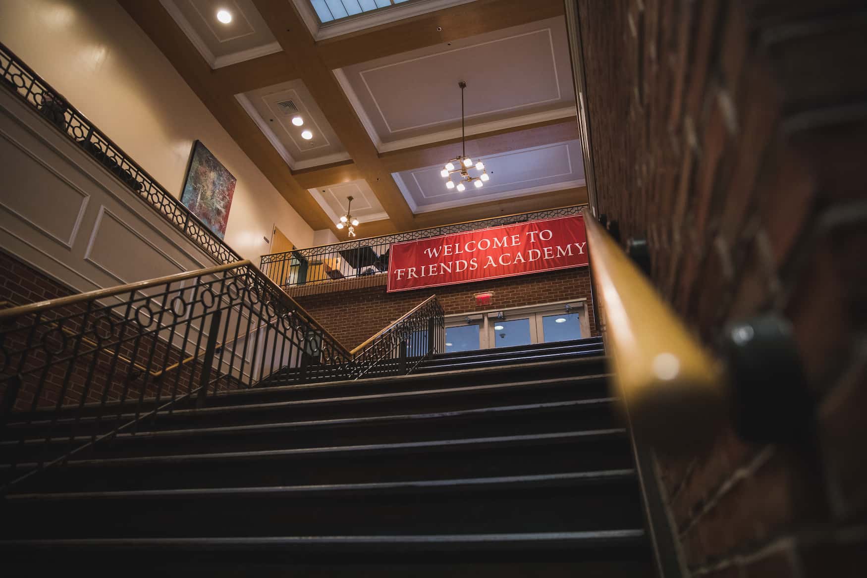 staircase with friends academy banner