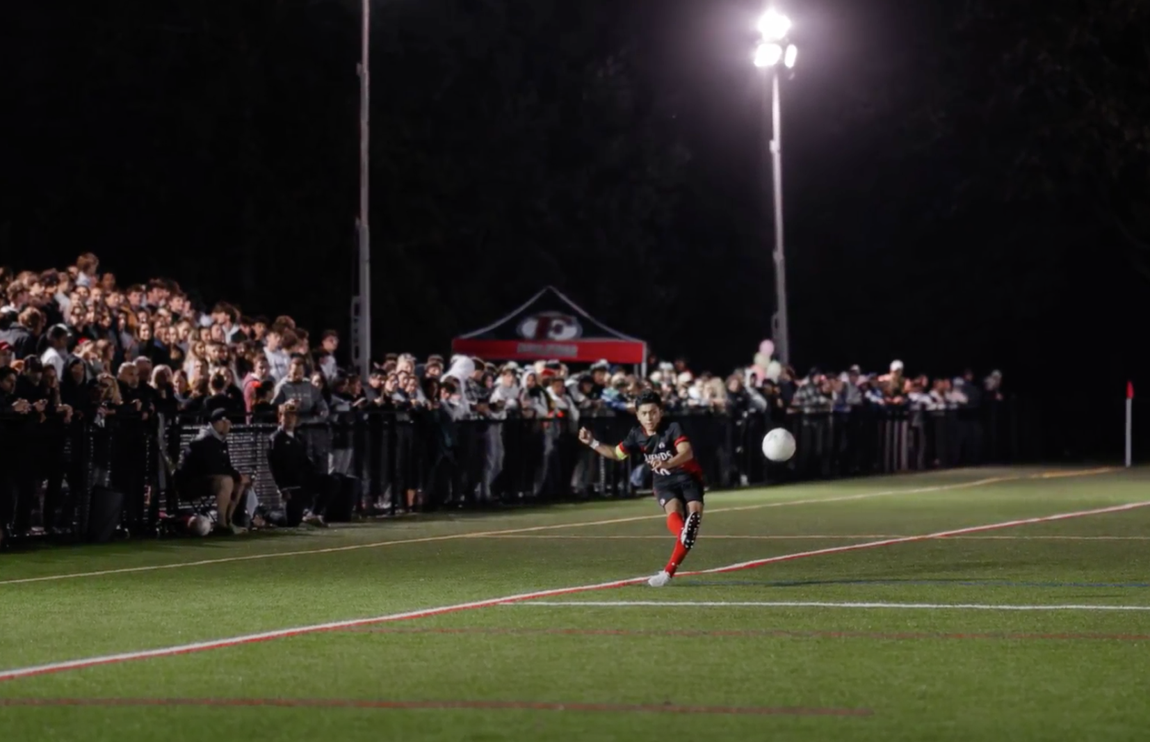 Boys Varsity soccer in front of crowd